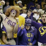 From left, Kelsey White, of South Bend, Ind., Justin Brice of Shreveport, La., Chase Lawson, Covington, La., and Cody Salomone also of Covington, La. cheer their team on before the start of the BCS championship college football game between LSU and Ohio State at the Louisiana Superdome in New Orleans, Monday, Jan. 7, 2008. (AP Photo/Chuck Burton)