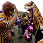 LSU fans tailgate before the BCS championship college football game between LSU and Ohio State at the Louisiana Superdome in New Orleans, Monday, Jan. 7, 2008. (AP Photo/Charlie Riedel)