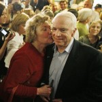 Republican presidential hopeful Sen. John McCain, R-Ariz., is kissed by an unidentified supporter at a campaign event at Applewood House of Pancakes in Pawley's Island, S.C., Friday, Jan. 11, 2008. (AP Photo/Charles Dharapak)