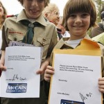 Brothers Cole and Ryan Miller hold up teacher's notes signed by Republican presidential hopeful Sen. John McCain, R-Ariz., since they missed school to attend McCain's campaign event at Applewood House of Pancakes in Pawley's Island, S.C., Friday, Jan. 11, 2008. (AP Photo/Charles Dharapak)