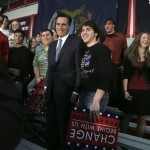 Republican presidential hopeful former Massachusetts Gov. Mitt Romney posses for a photo with students during a campaign stop at Grand Blanc High School in Grand Blanc, Mich., Monday, Jan. 14, 2008. (AP Photo/LM Otero)
