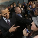 Democratic presidential hopeful Sen. Barack Obama, D-Ill., left, greets supporters at a town hall meeting held at Rosemary Clarke Middle School in Pahrump, Nev., Sunday, Jan. 13, 2008. (AP Photo/Jae C. Hong)
