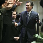 Republican presidential hopeful former Massachusetts Gov. Mitt Romney is greeted by applause as he walks up to speak at the Oakland County GOP Anniversary Gala at the Shenandoah Country Club in West Bloomfield , Mich., Monday, Jan. 14, 2008. (AP Photo/LM Otero)
