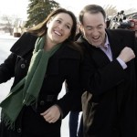 Republican presidential hopeful, former Arkansas Gov. Mike Huckabee, right, jokes with CBS correspondent Nancy Cordes at a polling place during a campaign stop in Warren, Mich. Tuesday, Jan. 15, 2008.(AP Photo/Alex Brandon)
