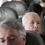 Republican presidential hopeful, Sen. John McCain, R-Ariz., sits on his campaign plane as it arrives in Ypsilanti, Mich., on the morning of Michigan's primary election Tuesday, Jan. 15, 2008. (AP Photo/Charles Dharapak)
