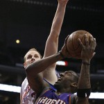 Phoenix Suns' Amare Stoudemire (1) drives on Los Angeles Clippers' Chris Kaman, left, in the first half of an NBA basketball game, Tuesday. (AP Photo/Gus Ruelas)