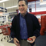 Republican presidential hopeful, former Massachusetts Gov. Mitt Romney, holds an easy button given to him after arrived at a Staples store for a media availability at a Staples store in Columbia, S.C., Thursday, Jan. 17, 2008. (AP Photo/LM Otero)