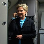 In this photo from video, Democratic presidential hopeful, Sen. Hillary Rodham Clinton, D-N.Y. jokingly welcomes the media aboard "Hil Force One" as she gives pre-flight instructions on the press plane in Las Vegas enroute to a campaign event in Reno, Nev. Wednesday, Jan. 16, 2008. (AP Photo/Pool, Mark LaGanga)