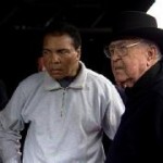 Muhammad Ali and Carroll Shelby shook hands following Shelby's private photo shoot with Barrett-Jackson executives Craig Jackson and Steve Davis, and the new Limited Edition Barrett-Jackson Ford Shelby Mustang. (KPHO.com)

