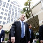 Republican presidential hopeful, Sen. John McCain, R-Ariz., center, walks with Sen. Lindsey Graham, R-S.C., right, as he leaves his hotel in Deerfield Beach, Fla., to attend a fundraising event, Thursday, Jan. 24, 2008. (AP Photo/Charles Dharapak)