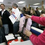 Democratic presidential hopeful former Sen. John Edwards, D-NC, signs a campaign poster and hands it back to Mary Hanks, right, after speaking to supporters at Whiteford's Giant Burger Thursday, Jan. 24, 2008, in Laurens, S.C. (AP Photo/Mary Ann Chastain)