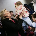 Democratic presidential hopeful, Sen. Hillary Rodham Clinton, D-N.Y., picks up eight-month-old Elainey Speight, of Anderson, S.C., at a town-hall style campaign event in Anderson Thursday, Jan. 24, 2008. (AP Photo/Elise Amendola)
