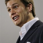 New England Patriots quarterback Tom Brady (12) responds to a reporter's question during a media availability upon the team's arrival at their hotel in Scottsdale, Ariz., Sunday evening Jan 27, 2008. The Patriots will play the New York Giants in Super Bowl XLII in Glendale, AZ., on Sunday Feb. 3, 2008. (AP Photo/Stephan Savoia)