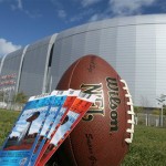 Super Bowl game tickets are seen with the University of Phoenix Stadium in the background Friday, Jan. 25, 2008, in Glendale, Ariz. The New England Patriots will play the New York Giants in Super Bowl XLII on Sunday, Feb. 3, 2008. (AP Photo/Ross D. Franklin)