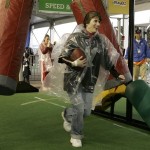 Louise Gates, of Florence, Ariz., runs with a football as she is timed for her run at the NFL Experience Sunday, Jan. 27, 2008, in Glendale, Ariz. The New England Patriots will play the New York Giants in Super Bowl XLII on Sunday, Feb. 3, 2008. (AP Photo/Ross D. Franklin)
