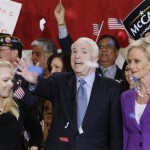 Republican presidential hopeful Sen. John McCain, R-Ariz., center, his wife Cindy and daughter Meghan celebrate as confetti falls during a campaign event in Orlando, Fla., Monday, Jan. 28, 2008. (AP Photo/Charles Dharapak)