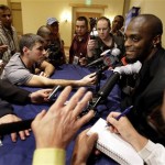 New York Giants wide receiver Plaxico Burress, right, answers questions during a press conference Monday, Jan. 28, 2008 in Chandler, Ariz. The Giants will play the New England Patriots in the Super Bowl on Sunday. (AP Photo/Julie Jacobson)