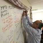 Republican presidential hopeful, former New York City Mayor Rudy Giuliani, signs the bulletin board as he visits visits his Broward County campaign headquarters in Pompano Beach, Fla. Tuesday, Jan. 29, 2008. (AP Photo/Gerald Herbert)
