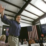 Republican presidential hopeful former Massachusetts Gov. Mitt Romney waves to supporters as he takes the stage for a campaign stop at the Panama City-Bay County International Airport in Panama City, Fla., Monday, Jan. 28, 2008. (AP Photo/LM Otero)