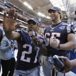 New England Patriots' Ellis Hobbs (27) and Wesley Britt (65) have some fun during media day for the Super Bowl XLII football game Tuesday, Jan. 29, 2008, in Glendale, Ariz,. (AP Photo/Julie Jacobson)