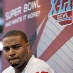 New York Giants defensive end Osi Umenyiora listens to a question during media day for the Super Bowl XLII football game Tuesday, Jan. 29, 2008, in Glendale, Ariz,. (AP Photo/Stephan Savoia)