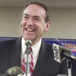 Former Arkansas governor and Republican presidential candidate Mike Huckabee laughs during a campaign event Tuesday, Jan. 29, 2008, in Jefferson City, Mo. Huckabee told about 200 supporters that he needs to do well in Midwestern and Southern states holding primaries on Feb. 5. (AP Photo/Kelley McCall)
 