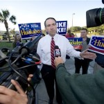 Republican presidential hopeful and former Arkansas Gov. Mike Huckabee talks with reporters outside a polling station at Westchase Golf ClubTuesday, Jan. 29, 2008, in Tampa, Fla. (AP Photo/Steve Nesius)
