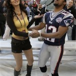 New England Patriots' Bam Childress dances with reporter Marisol Gonzalez during media day for the Super Bowl XLII football game Tuesday, Jan. 29, 2008, in Glendale, Ariz,. (AP Photo/Stephan Savoia)
