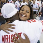  Actress Claudia Jordan hugs New York Giants' Anthony Wright during media day for the Super Bowl XLII football game Tuesday, Jan. 29, 2008, in Glendale, Ariz,. (AP Photo/Stephan Savoia)