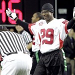 Former NFL football player and team Nacionales player Eric Dickerson (29) argues and off-sides call with the referee during the Tazon Latino II football game against team Americanos at the NFL Experience on Wednesday, Jan 30, 2008 in Glendale, Ariz. (AP Photo/Matt York)