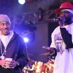 Rapper 50 Cent, right, performs on the Pontiac Garage Stage as Ludac