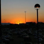 The sun sets over the parking lot at FBR in Scottsdale. (Steven Falkenhagen/Sports 620 KTAR)