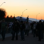 A crowd of people walk from the TPC to the Birds Nest as the sun sets over the desert. (Steven Falkenhagen/Sports 620 KTAR)