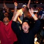 Ryan Bunger, center, and others celebrate the New York Giants victory while watching a TV broadcast of the Super Bowl XLII football game between the New York Giants and New England Patriots at ESPN Zone in Times Square Sunday, Feb. 3, 2008 in New York. (AP Photo/Gary He)