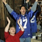 Giants fans react as they watch Super Bowl XLII at Manny's in Moonachie, N.J. as the New York Giants play the New England Patriots Sunday, Feb. 3, 2008 (AP Photo/Bill Kostroun)