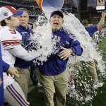 New York Giants head coach Tom Coughlin is doused after the Giants beat the New England Patriots 17-14 in the Super Bowl XLII football game on Sunday, Feb. 3, 2008, in Glendale, Ariz. (AP Photo/David J. Phillip)