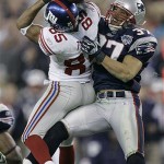 New York Giants receiver David Tyree (85) makes a 32-yard reception as New England Patriots safety Rodney Harrison (37) defends during the fourth quarter of the Super Bowl XLII football game at University of Phoenix Stadium on Sunday, Feb. 3, 2008 in Glendale, Ariz. (AP Photo/Matt Slocum)