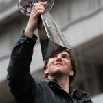 New York Giants quarterback Eli Manning holds the Vince Lombardi Trophy as he rides through the Super Bowl victory parade Tuesday, Feb. 5, 2008 in New York. (AP Photo/Gary He)
