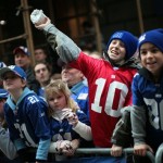 New York Giants fan Connor Ryan, 10, throws a roll of toilet paper during the Super Bowl victory parade Tuesday, Feb. 5, 2008 in New York. (AP Photo/Gary He)
