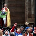 Father James Cooper of Trinity Church watches from a ladder during a Super Bowl parade celebrating the New York Giants victory Tuesday, Feb. 5, 2008 in New York. The Giants defeated the New England Patriots, 17-14, in Sunday's National Football League championship game.(AP Photo/Gary He)

