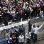 Players wave to fans as the Super Bowl Champion New York Giants receive a ticker tape parade in Lower Manhattan through the "Canyon of Heroes" Tuesday, Feb. 5, 2008 in New York. (AP Photo/Jason DeCrow)
