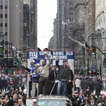 New York Giants players Michael Strahan, left, and Eli Manning celebrate during a Super Bowl parade in New York on Tuesday, Feb. 5, 2008. The Giants defeated the New England Patriots, 17-14, in Sunday's National Football League championship game. (AP Photo/Mike Groll)
