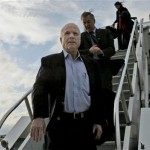 Republican presidential hopeful Sen. John McCain, R-Ariz., followed by Sen. Lindsey Graham, R-S.C., and traveling press secretary Brooke Buchanan, steps off his charter plane as he arrives at Dulles Airport in Chantilly, Va., the day after his Super Tuesday primary elections wins Wednesday, Feb. 6, 2008. (AP Photo/Charles Dharapak)