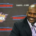 Shaquille O'Neal smiles as he is introduced as a new Phoenix Suns NBA basketball player at a news conference on Thursday, Feb. 7, 2008, in Phoenix. (AP Photo/Ross D. Franklin