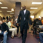 New Phoenix Suns basketball player Shaquille O'Neal walks into a news conference where he was introduced Thursday, Feb. 7, 2008, in Phoenix. The NBA trade sent O'Neal to the Suns and Shawn Marion and Marcus Banks to the Miami Heat. (AP Photo/Ross D. Franklin)