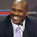 A smiling Shaquille O'Neal is introduced as a new Phoenix Suns basketball player at a news conference on Thursday, Feb. 7, 2008, in Phoenix. The NBA trade sent Shawn Marion and Marcus Banks to Miami for O'Neal. (AP Photo/Ross D. Franklin)