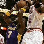 Los Angeles Lakers forward Lamar Odom (7) looks to shoot as Miami Heat forward Dorell Wright (1) defends in the first quarter during a basketball game in Miami, Sunday, Feb. 10, 2008. (AP Photo/Lynne Sladky)