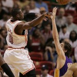 Miami Heat guard Dwyane Wade 93) shoots as Los Angeles Lakers forward Pau Gasol of Spain, right, defends in the first quarter during a basketball game in Miami Sunday, Feb. 10, 2008. (AP Photo/Lynne Sladky)
