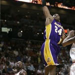 Los Angeles Lakers guard Kobe Bryant (24) shoots in the second quarter as Miami Heat guard Dwyane Wade, left, looks on during a basketball game in Miami, Sunday, Feb. 10, 2008. (AP Photo/Lynne Sladky)
