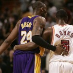 Los Angeles Lakers guard Kobe Bryant (24) and Miami Heat guard Marcus Banks (5) walk off the court following a Lakers 104-94 victory during a basketball game in Miami, Sunday, Feb. 10, 2008. Banks scored seven points in his debut with the Heat after a trade with the Phoenix Suns. (AP Photo/Lynne Sladky)
